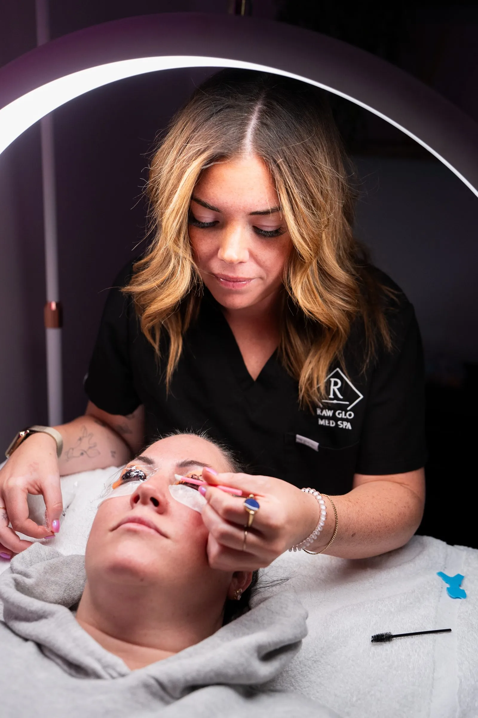 An LED light facial in progress under a ring light